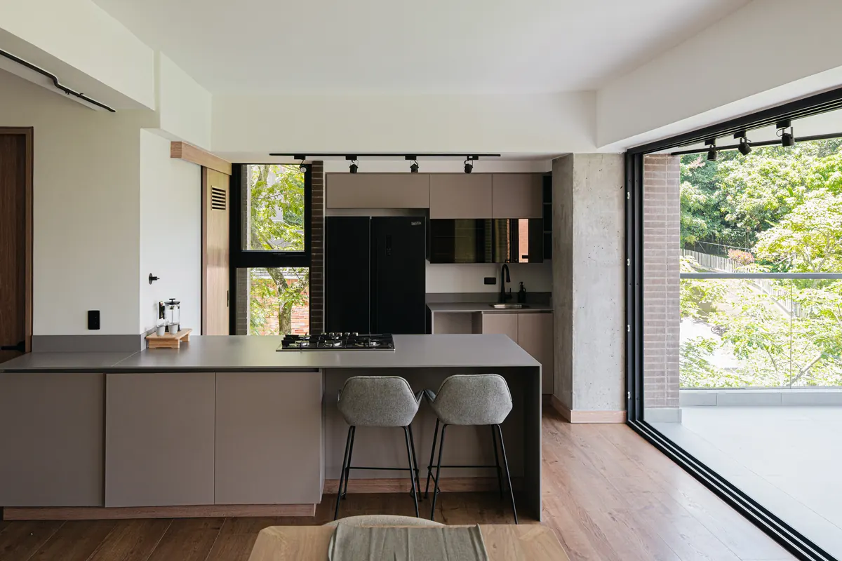 Kitchen with an island and access to the balcony